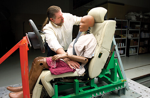 Warren Hardy with a crash test dummy