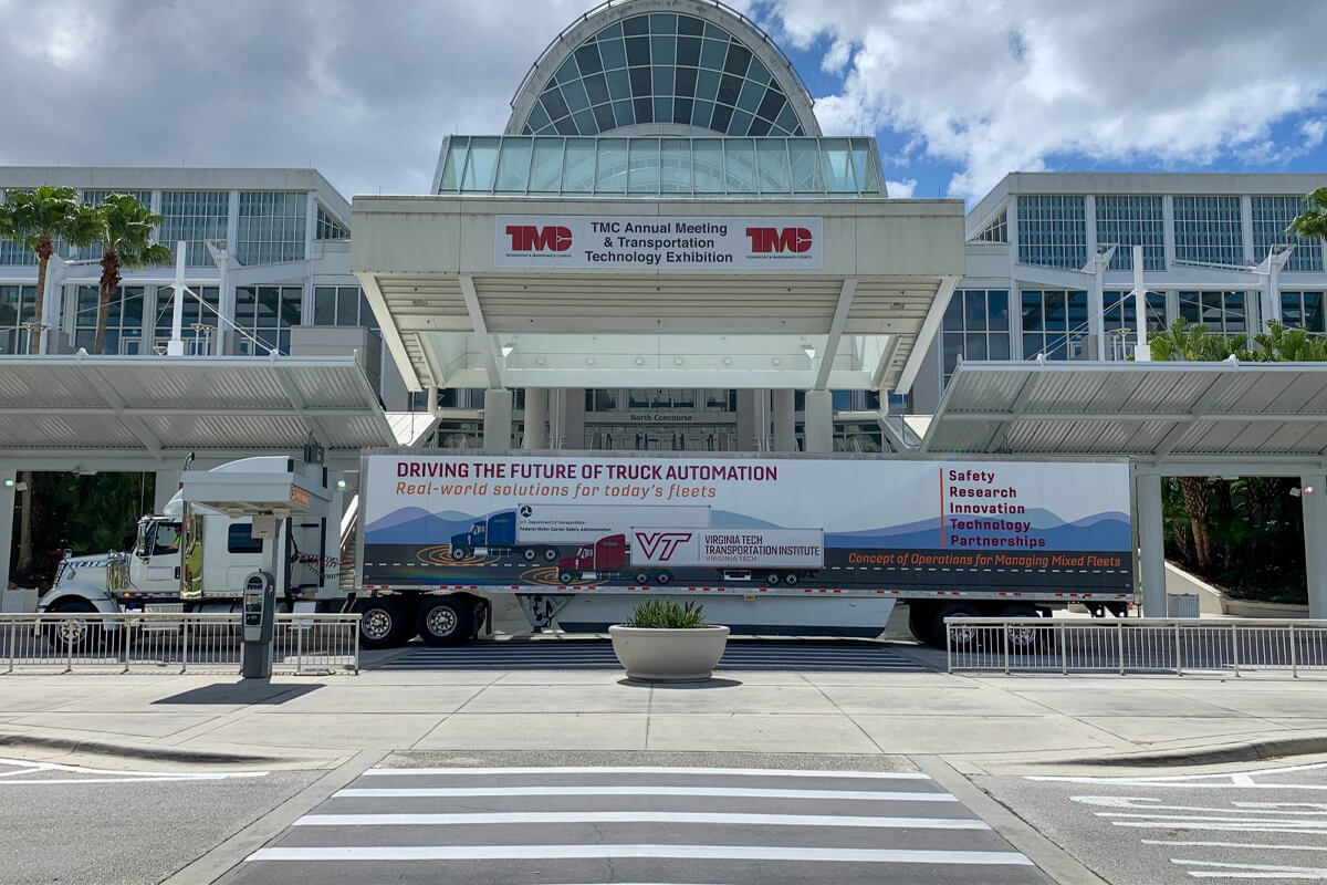 Tractor trailer parked in front of a convention center in Orlando, FL.