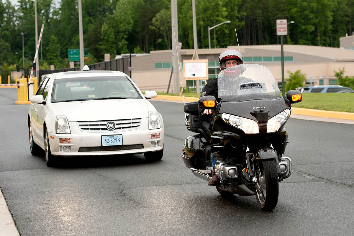 Car and  motorcycle on road