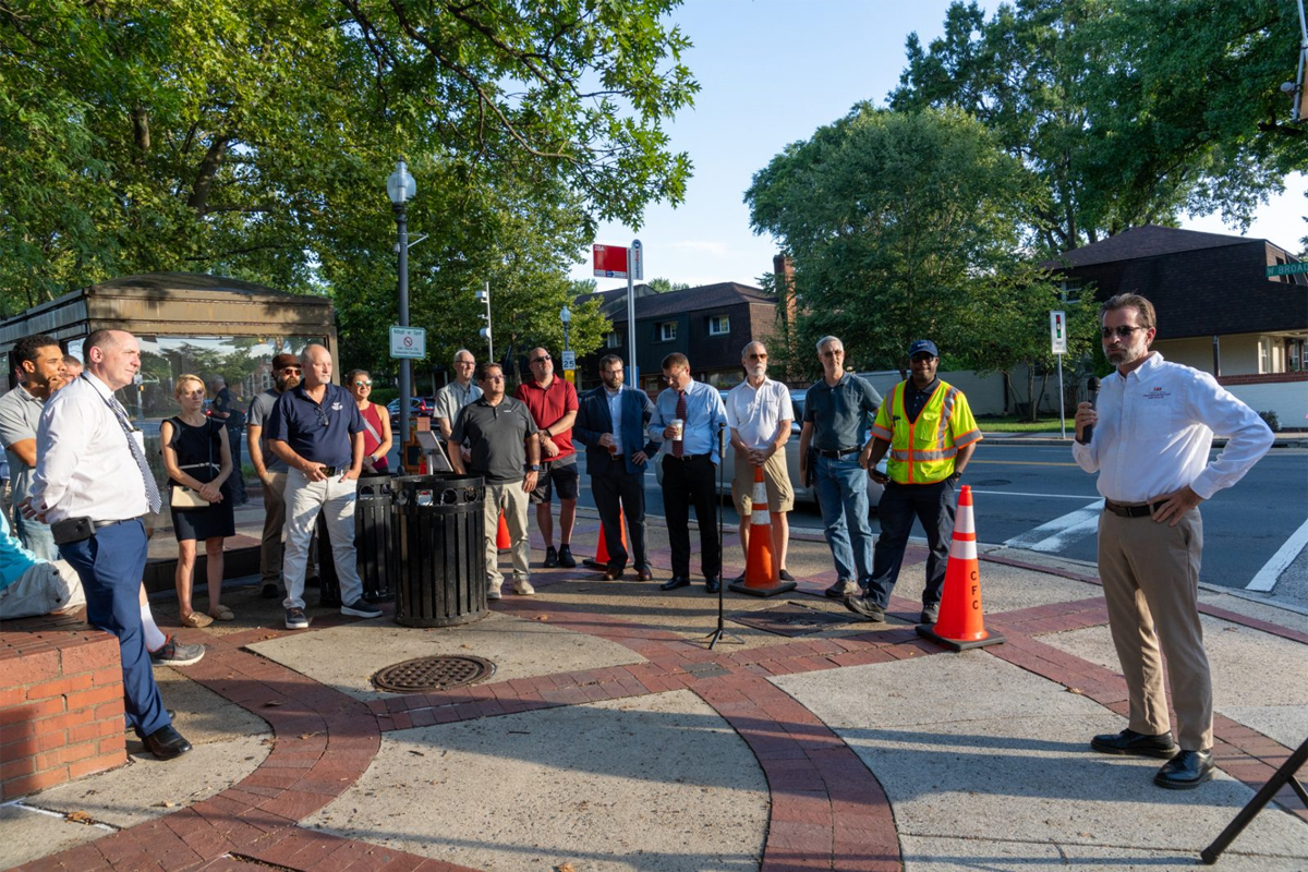 Virginia Tech Transportation Institute Executive Director Zac Doerzaph (far right) speaks at the unveiling of the Smart City test bed in Falls Church. (Photo Courtesy Gary Mester/Written in Light Photography)