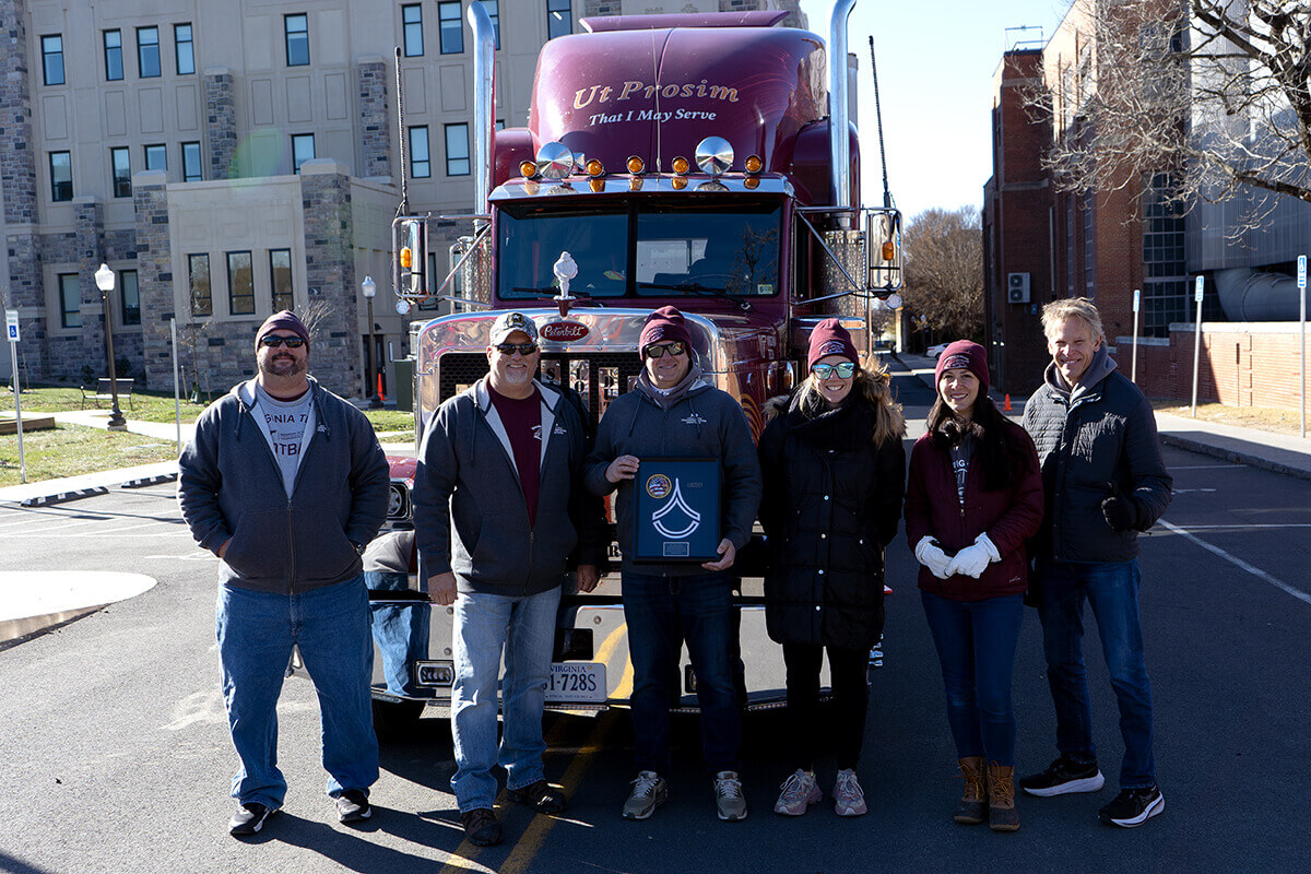 The Sharing the Road team (from left to right: Mark Golusky, Scott Tidwell, Eileen Herbers, Susan Soccolich, and Rich Hanowski) posing with an award