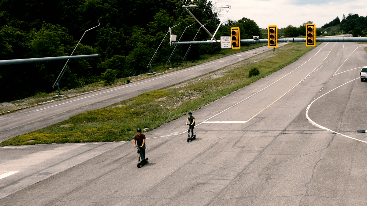 Scooter riders moving through an intersection