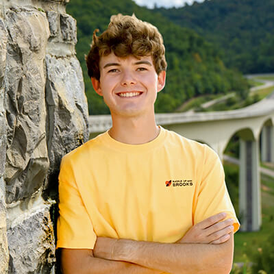 TJ Brooks standing in front of the Smart Roads bridge